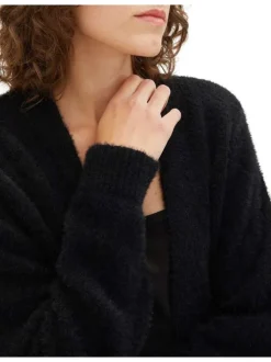 Gilet noir uni avec une coupe droite et un tissu en fausse fourrure
