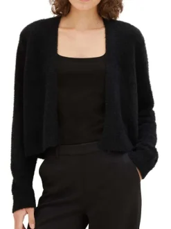 Gilet noir uni avec une coupe droite et un tissu en fausse fourrure