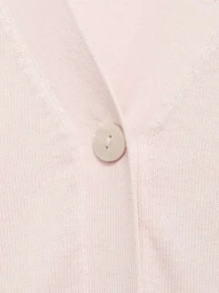 Gilet rose uni avec une coupe droite à col v et des manches longues