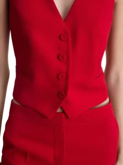 Gilet rouge uni avec une coupe droite à col v et sans manches