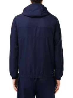 Imperméable à capuche marine avec une coupe droite et un col montant