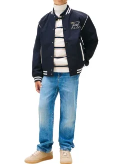 Jean en coton bleu uni coupe regular avec le patch de la marque à l'arrière