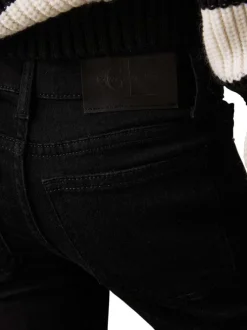 Jean en coton noir uni à coupe bootcut avec poches plaquées et patch