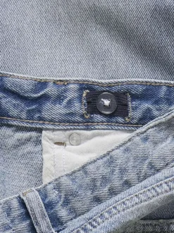 Jean en coton stone uni à fermeture zippée et bouton avec effet usé