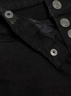 Jean noir uni en coton avec une coupe skinny fermé par des boutons gris à poches