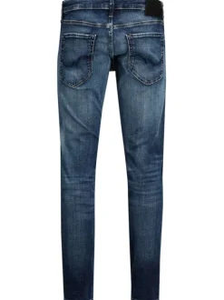 Jean bleu délavé avec une coupe ajustée et une fermeture zippée boutonnée