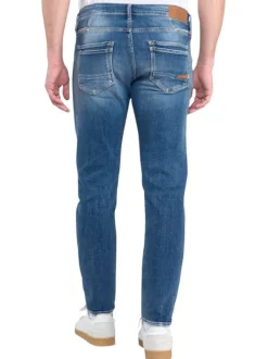 Jean bleu fermé par deux boutons délavé avec une coupe slim fit