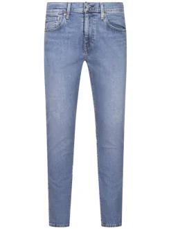 Jean 512 bleu uni en coton mélangé avec une coupe slim et un patch