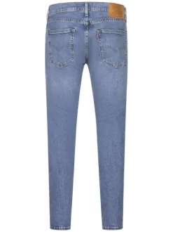 Jean 512 bleu uni en coton mélangé avec une coupe slim et un patch