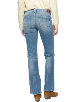 Jean bootcut travaillé en coton stretch bleu délavé à pierres turquoises et jambes évasées