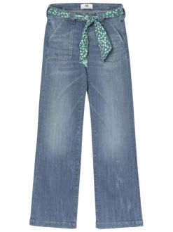Jean bootcut travaillé en coton stretch bleu délavé à pierres turquoises et jambes évasées