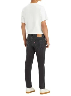 Jean 512 brut uni avec une coupe slim et un patch d'authentification