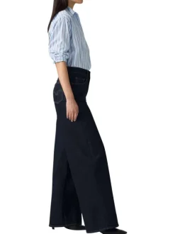 Jean brut uni en coton avec une coupe bootcut et multiples poches plaquées
