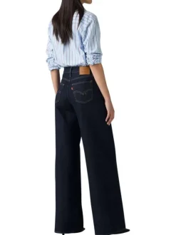 Jean brut uni en coton avec une coupe bootcut et multiples poches plaquées
