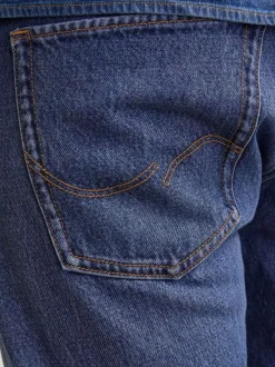 Jean Chris bleu avec une coupe droite à fermeture zippée et bouton