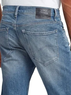 Jean en coton bleu avec une coupe droite et des passants à la taille