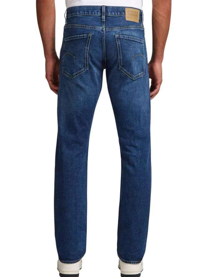 Jean en coton bleu avec une coupe droite et des passants pour ceinture