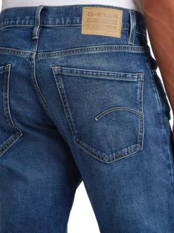Jean en coton bleu avec une coupe droite et des passants pour ceinture