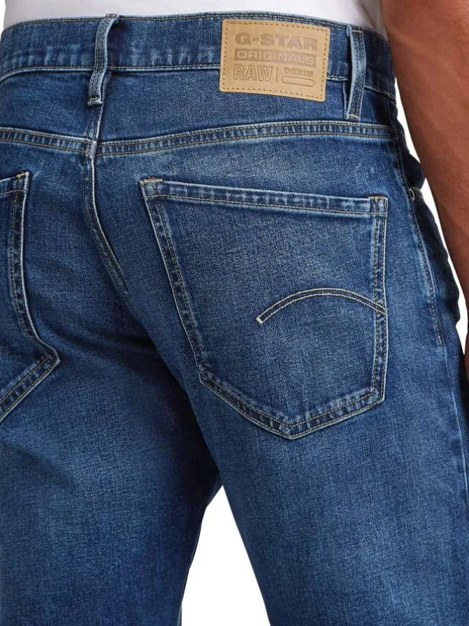 Jean en coton bleu avec une coupe droite et des passants pour ceinture