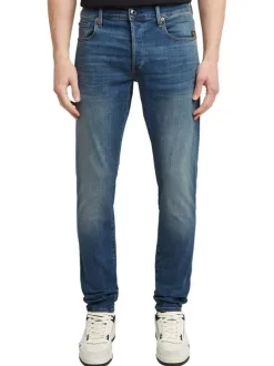 Jean en coton bleu avec une coupe slim et des passants pour ceinture