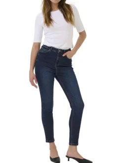 Jean en coton bleu brut délavé avec une coupe slim et 5 poches