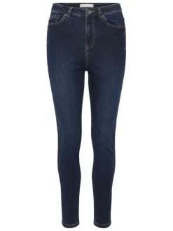 Jean en coton bleu brut délavé avec une coupe slim et 5 poches