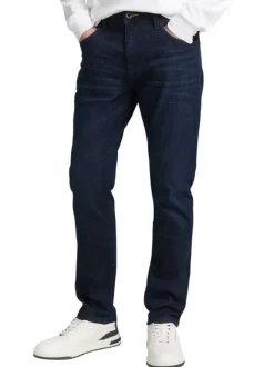 Jean en coton bleu brut légèrement délavé avec une coupe slim
