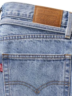 Jean en coton bleu clair uni avec une coupe bootcut et une ceinture amovible