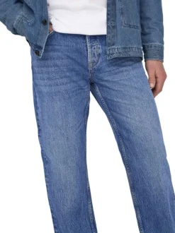 Jean en coton bleu délavé avec une coupe regular fit et une braguette à boutons