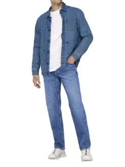 Jean en coton bleu délavé avec une coupe regular fit et une braguette à boutons