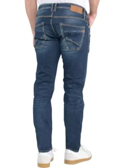 Jean en coton bleu délavé avec une coupe slim et un style 5 poches
