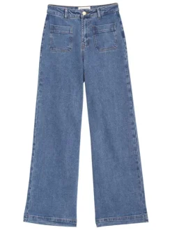 Jean en coton bleu délavé à coupe flare avec 4 poches et surpiqûres orange