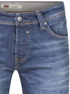Jean en coton bleu délavé fermé par des boutons avec une coupe regular fit