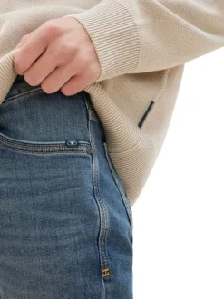 Jean en coton bleu indigo délavé aux cuisses avec une coupe slim fit
