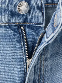 Jean en coton bleu stone délavé avec une coupe bootcut et 5 poches