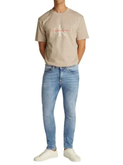 Jean en coton bleu stone délavé avec une coupe slim et une taille intermédiaire