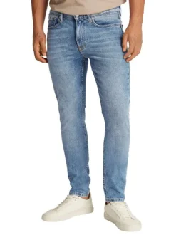 Jean en coton bleu stone délavé avec une coupe slim et une taille intermédiaire