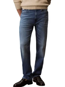 Jean en coton bleu uni avec une coupe droite à zip et à bouton