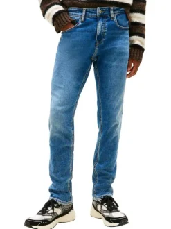 Jean en coton bleu uni avec une coupe slim à zip et à bouton