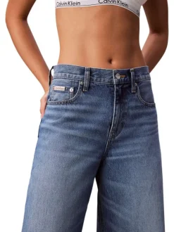 Jean en coton bleu uni avec une coupe wide leg à zip et bouton
