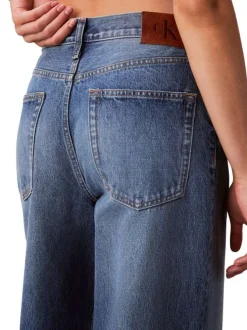 Jean en coton bleu uni avec une coupe wide leg à zip et bouton