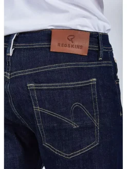 Jean en coton brut avec une coupe ajustée et des passants pour la ceinture