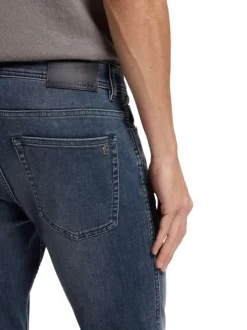 Jean en coton brut à coupe slim pourvu de multiples poches plaquées