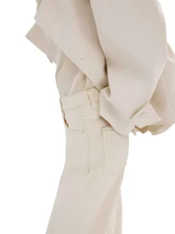 Jean en coton écru uni pourvu d'une coupe bootcut et d'une taille haute