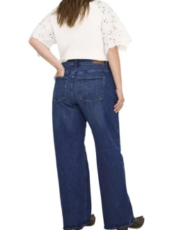 Jean en coton indigo coupe bootcut pourvu de passants pour la ceinture