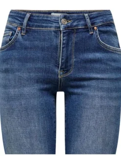 Jean en coton indigo délavé avec une coupe slim et des surpiqûres beiges