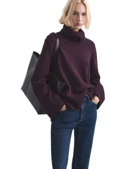 Jean 7/8 en coton indigo uni avec une coupe mom et une taille haute