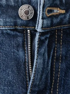 Jean 7/8 en coton indigo uni avec une coupe mom et une taille haute
