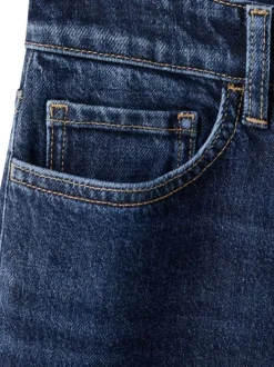 Jean 7/8 en coton indigo uni avec une coupe mom et une taille haute