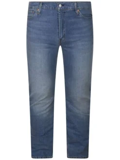 Jean en coton indigo uni avec une coupe slim et une fermeture par zip et bouton